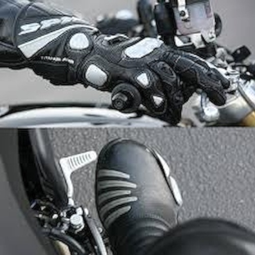 Photograph of a motorcyclist's gloved hand on the front brake and booted foot on the rear brake