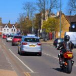 Busy street with cars and motorcycles